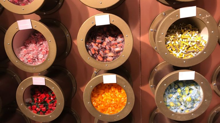 Candytopia: Wonka-esque sweets pop-up is extended through the holiday season 31 Of course, after all that hard work, you'll be able to purchase your favorite sweets. There's an entire wall of candies to choose from, not to mention the tables of chocolates (apparel, trinkets and other merch).