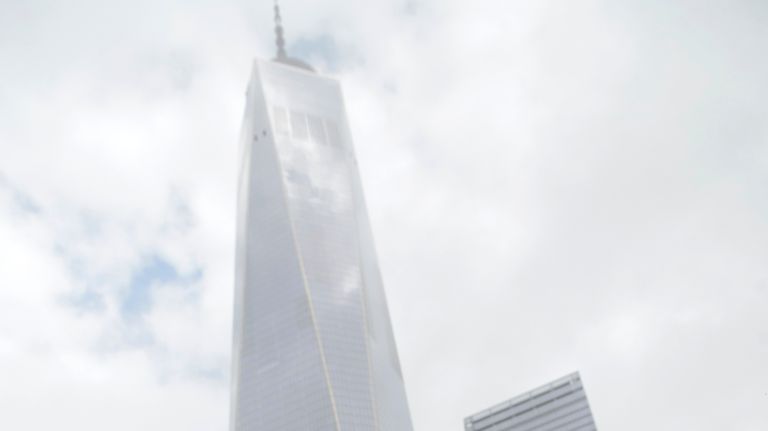 Flowers and flags left at the 9/11 memorial's south pool during a commemoration ceremony marking the 17th anniversary of the terrorist attacks on Tuesday.