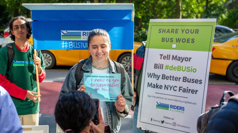 Bus advocates decry failing service, target de Blasio's leadership 1 Riders Alliance members tour the city with a cardboard bus shelter in tow on Thursday to raise awareness of the city bus system's shortcomings.