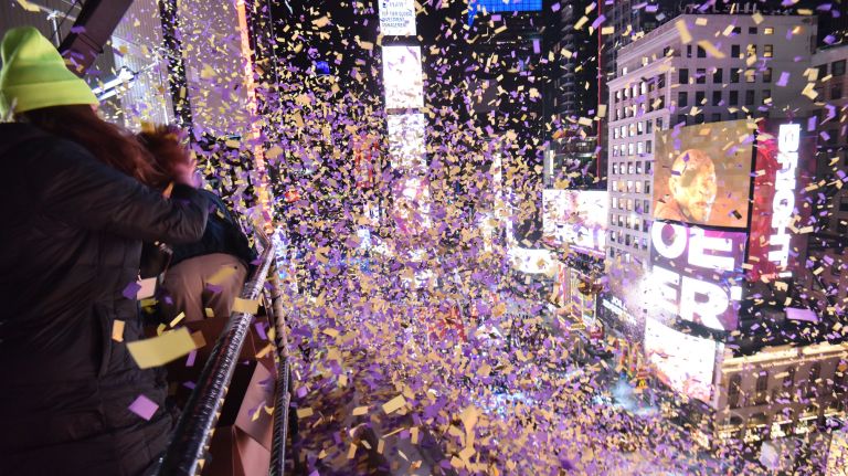 Confetti rains down on New Year's eve revelers from the New York Marriott Marquis Hotel in Times Square on Sunday, Dec. 31, 2017.