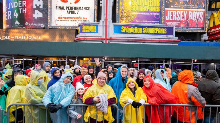 Event-goers stand in their rain gear as they wait for the New Year's Eve celebration performances to begin in Manhattan on&nbsp;Dec. 31, 2018.