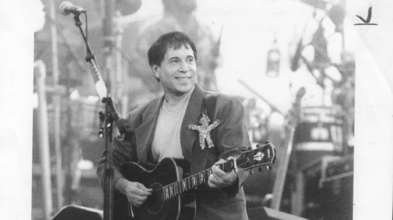 Paul Simon takes the stage at his free concert in Central Park on Aug. 15, 1991. The artist recorded the live album 