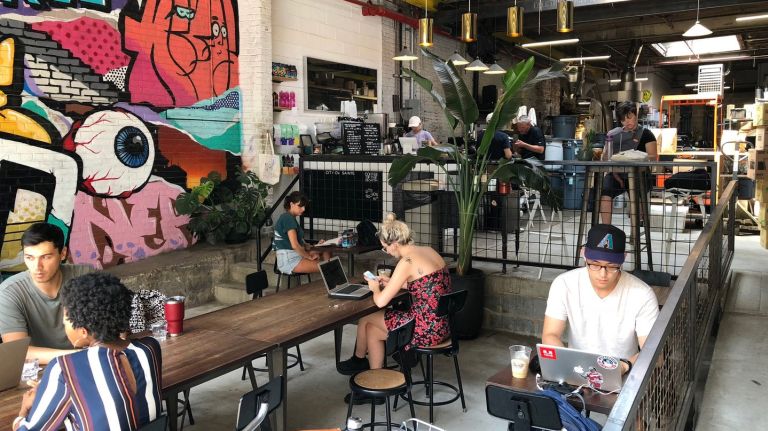 You may have seen a City of Saints cafe in the East Village, Bryant Park, on Pier 76 or on the other side of the Hudson in Hoboken, New Jersey. The store at 297 Meserole St. is the coffee pros' roasting home base, and the perfect place to start your day in the 'Burg. The line between storage, seating and service is perfectly blurred as you enter beneath the rolling garage door. Saints partners with a host of organizations for its international beans, including Genuine Origin Coffee Project for Honduras, Onyx Green coffee Importers and K-Finos for Guatemala, and Royal New York and Pergamino Coffee for Columbia.