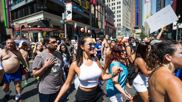 The annual GoTopless Day parade drew a crowd of both men and women in Manhattan on Saturday, Aug. 26, 2017.