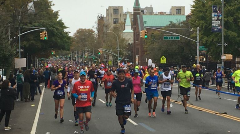 Runners pass through the Bay Ridge section of Brooklyn during the 2017 TCS New York City Marathon on Sunday, Nov. 5, 2017.