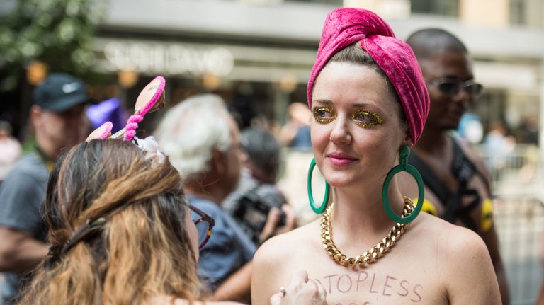 Elle Wesseling, 28, of Sydney, Australia, takes part in the GoTopless Parade on 58th Street between Eighth and Ninth avenues in Manhattan on Saturday, Aug. 26, 2017.