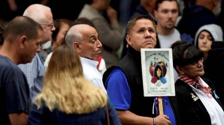 The families of 9/11 victims gather at the National September 11 Memorial & Museum at Ground Zero for a ceremony commemorating the 17th anniversary of the terror attacks on Tuesday.