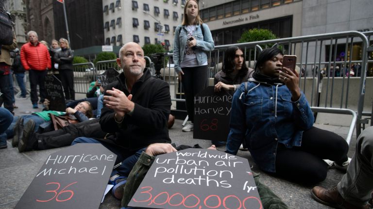 Protesters urge President Donald Trump to combat climate change during a demonstration at Trump Tower on the sixth anniversary of superstorm&nbsp;Sandy's landfall on&nbsp;Monday.