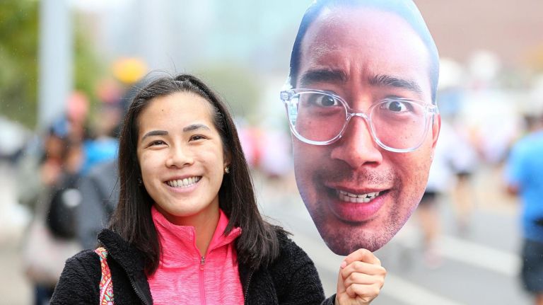 A woman in Long Island City cheers for a runner during the New York City Marathon on Nov. 5, 2017.