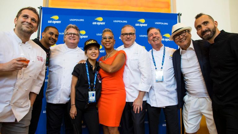 USTA president Katrina Adams, center, joins chefs Paul Denamiel, from left, JJ Johnson, David Burke, Esther Choi, Ed Brown, Jim Abbey, Masahura Morimoto and Marc Forgione at a tasting preview Thursday at the U.S. Open in Flushing Meadows.