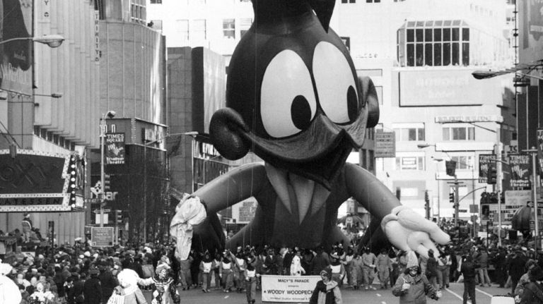 Thanksgiving parade balloons through the years 14 A partially deflated Woody Woodpecker marches down Broadway in the Macy's Thanksgiving Day Parade on Nov. 25, 1993. Woody Woodpecker first appeared in the parade in 1982.