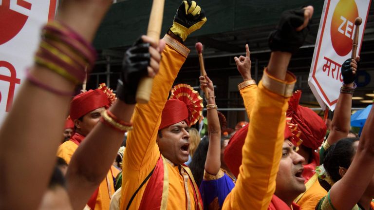 Performers cheer before the start of the 38th Indian Day Parade.