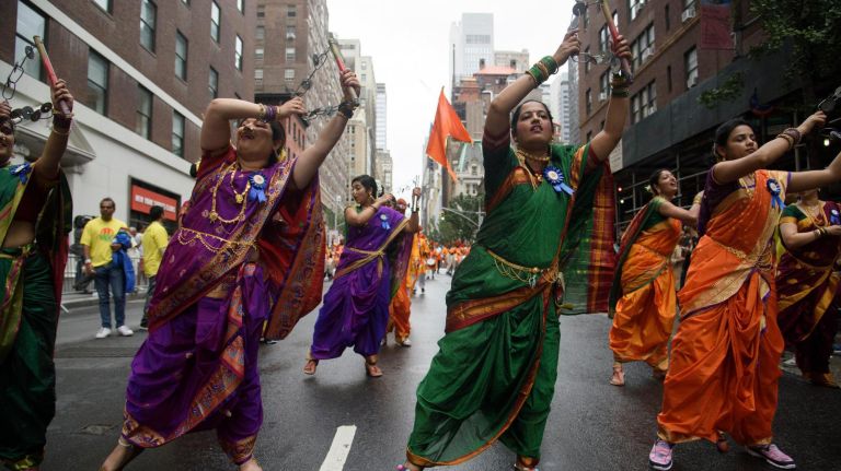 Performers dance to traditional Indian music.