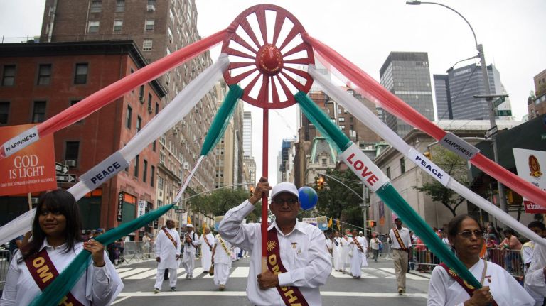 People proudly march in the parade.
