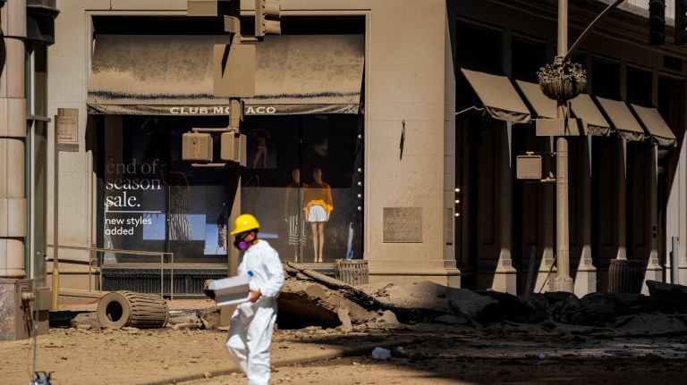 Debris covers the immediate area near the site of a steam pipe explosion that prompted concerns of asbestos contamination. 