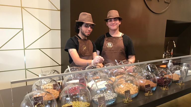 This is the second year working behind Magnum's pop-up counter for both Jayden Taveras, 24, left, and Ginger Maldonado, 22. Take it from the pros: The shop is open from 11 a.m. to 8 p.m. Mondays through Saturdays and 11 a.m. to 7 p.m. on Sundays, but your best bet to avoid long lines is heading over first thing in the morning or right before closing. 