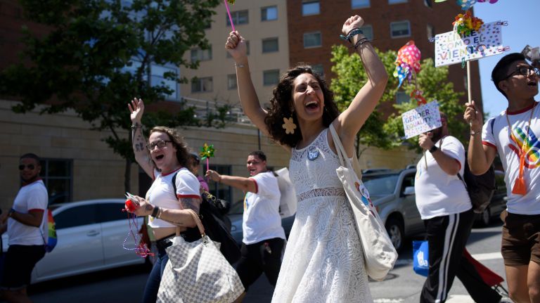 1 Bronx Pride March: Advocates parade through the streets 17 Members of the LGBTQ community and their supporters cheer as a motorist honks his horn during the Bronx Pride March.