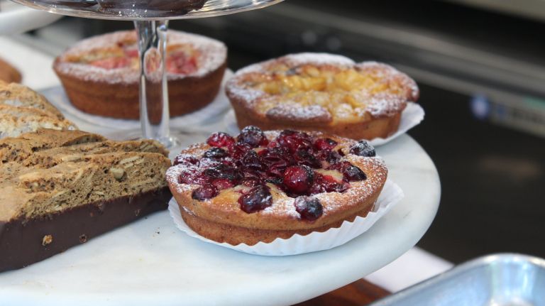 What to do and eat in Inwood in northern Manhattan 12 As the sun sets, one of the best vantage points is cozy Isham Park. Like most of the parks in Inwood, there are several entrances and charming paths up, but either way be ready to climb some serious stairs. Before you head up, stop across the street at Choc NYC (4996 Broadway) near 212th Street. The bakers at Choc churn out goods so attractive you'll almost feel bad about biting into them. Since you'll be in the park, go for the finger-friendly individual fruit tart ($5.75), the pistachio eclair ($4.50) or the coconut macaroon ($2.75).