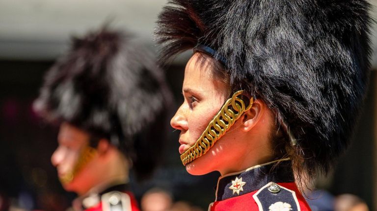 A mock-up of Windsor Castle complete with royal family guards sets the stage.