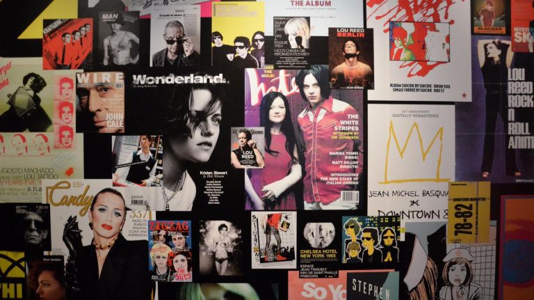 The "Legacy" wall contains hundreds of images to represent the band's reach.