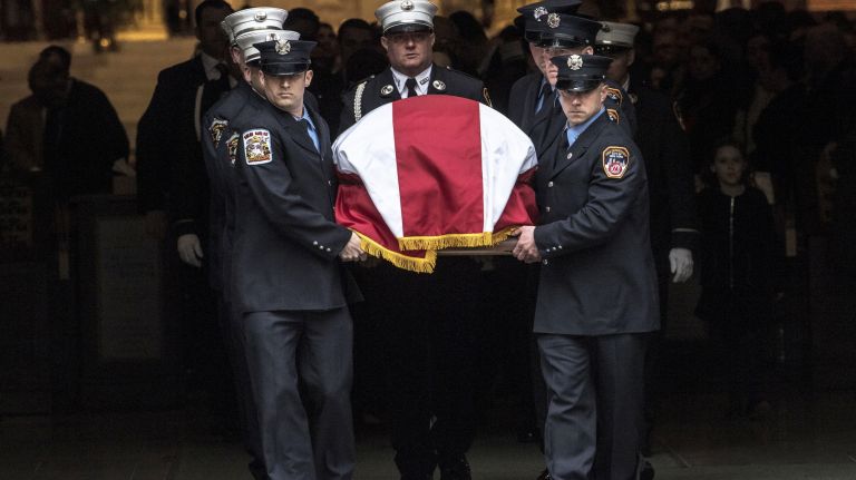 Michael Davidson's casket is carried out of St. Patrick's Cathedral after his funeral on Tuesday.
