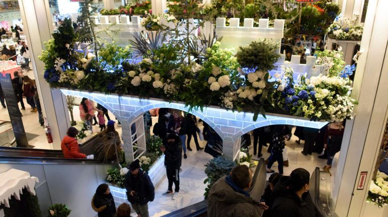 Macy’s Flower Show creates a fairy tale of flowers 18 People ride an escalator past