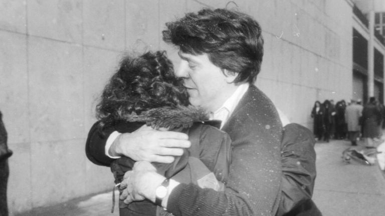 Office workers embrace on the street after evacuating the World Trade Center on Feb. 26, 1993.