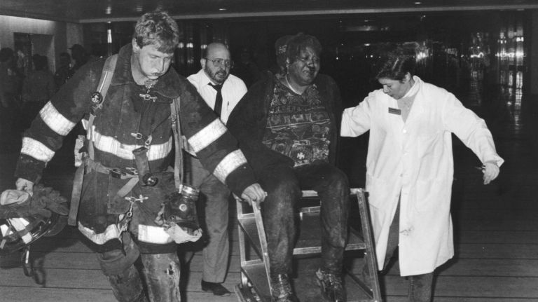 Rescue workers use a coffee cart to remove an injured woman from the PATH train station in the World Trade Center on Feb. 26, 1993.