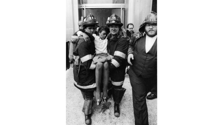 Firefighters carry an injured woman from the World Trade Center after the explosion in the north tower on Feb. 26, 1993.