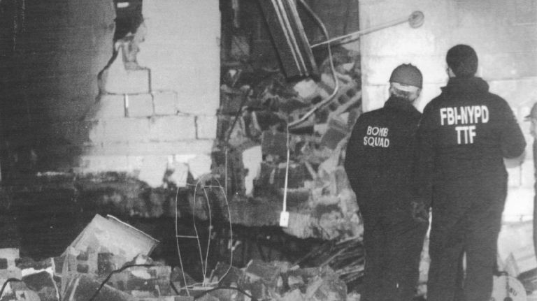 Members of the bomb squad and FBI examine damage in the garage of the World Trade Center's north tower on Feb. 27, 1993.