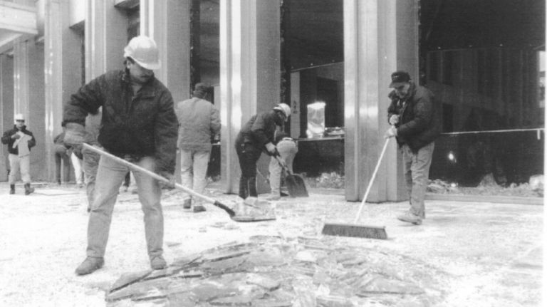 Crews clean up glass and debris at the site of the previous day's bombing at the World Trade Center on Feb. 27, 1993.