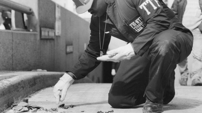 A member of the FBI's terrorist task force collects evidence on one of the garage ramps of the World Trade Center on March 1, 1993.