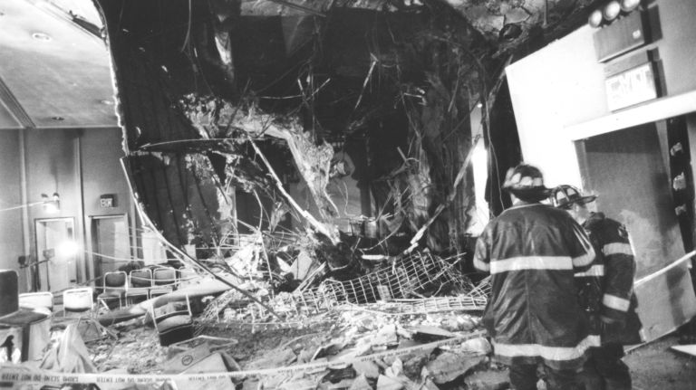Firefighters examine damage to the lobby of the Vista Hotel, located over the blast site in the World Trade Center's north tower, on March 12, 1993.
