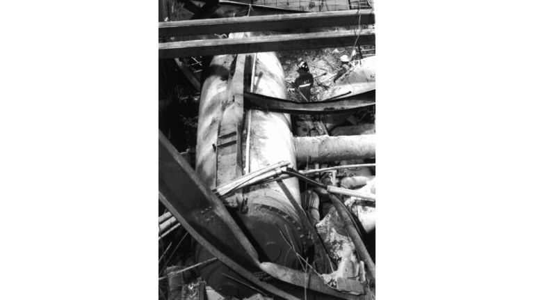 A Bureau of Alcohol, Tobacco, Firearms and Explosives agent inspects a damaged piece of air conditioning equipment on level B-5 in the World Trade Center's north tower on March 17, 1993.