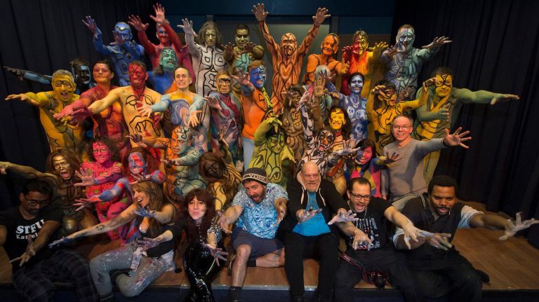 Photos: Body painting event in Times Square turned heads 7 Artist and organizer Andy Golub (center bottom row), body painters and models pose during a Polar Bear Paint event in Manhattan on Saturday, Feb. 10, 2018. Golub assembled 25 models, who were body painted and then displayed at the red stairs in Times Square. Each model's paint revolved around the theme of movement.