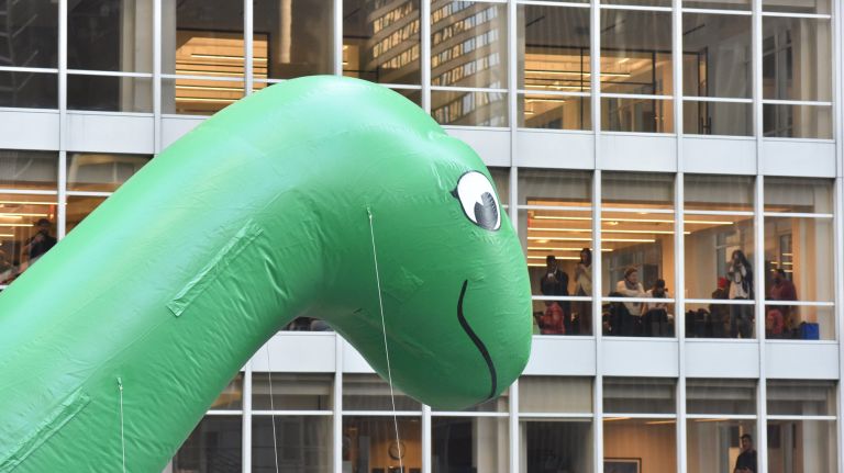 Sinclair Oil's Dino balloon makes eye contact in the parade. 