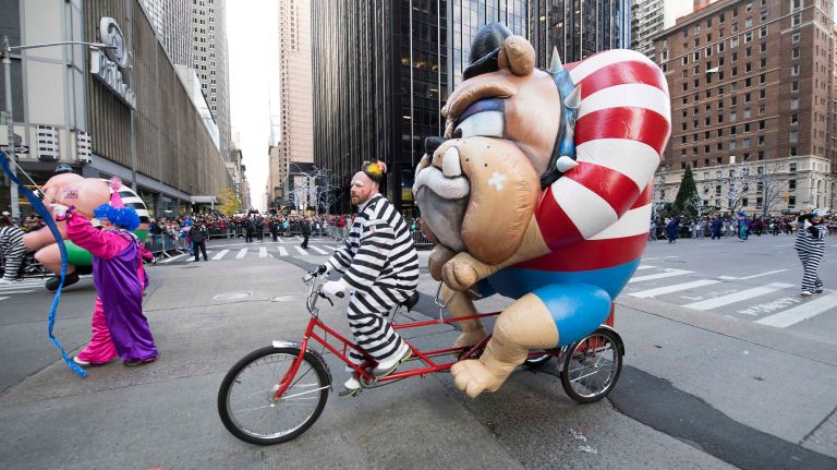 The Tough Guy & Bulldog Trycaloon makes its way down Sixth Avenue on Thursday, Nov. 24, 2016, during the 90th annual Macy's Thanksgiving Day Parade.