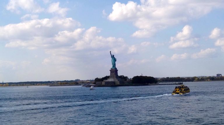 St. George, Staten Island: What to do and where to eat in this harborfront neighborhood 11 Ignore the hawkers who will try to sell you a ticket for a Statue of Liberty boat tour. The ferry offers fantastic views of Lady Liberty, along with the Manhattan skyline and the Verrazano-Narrows Bridge, the longest suspension bridge in the country. Play tourist, sit outside and snap some photos.