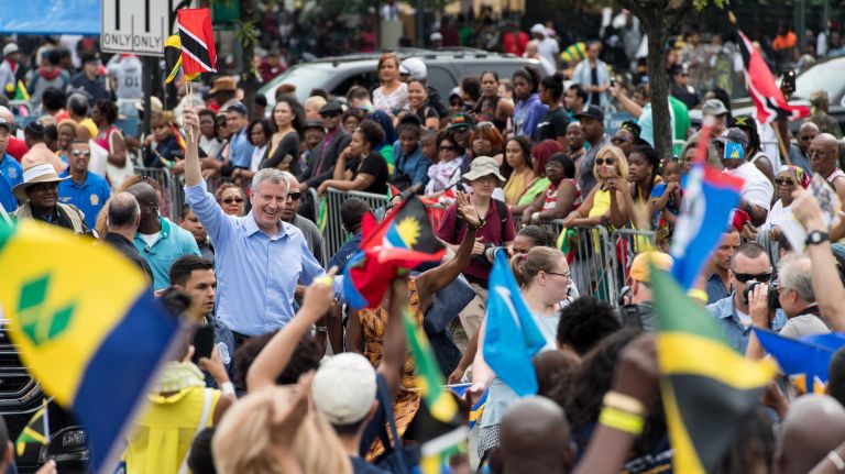Mayor Bill de Blasio and his wife, Chirlane McCray, march in the West Indian Day Parade along Eastern Parkway in Brooklyn on Monday, Sept. 5, 2016. 