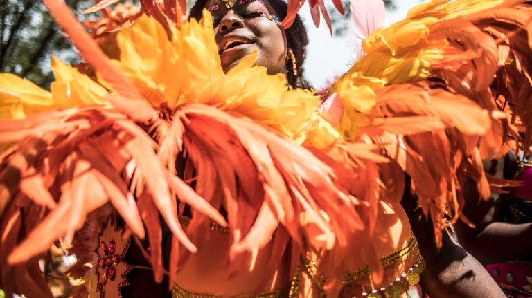 A costumed dancer marches in the West Indian Day Parade along Eastern Parkway in Brooklyn on Monday, Sept. 5, 2016.