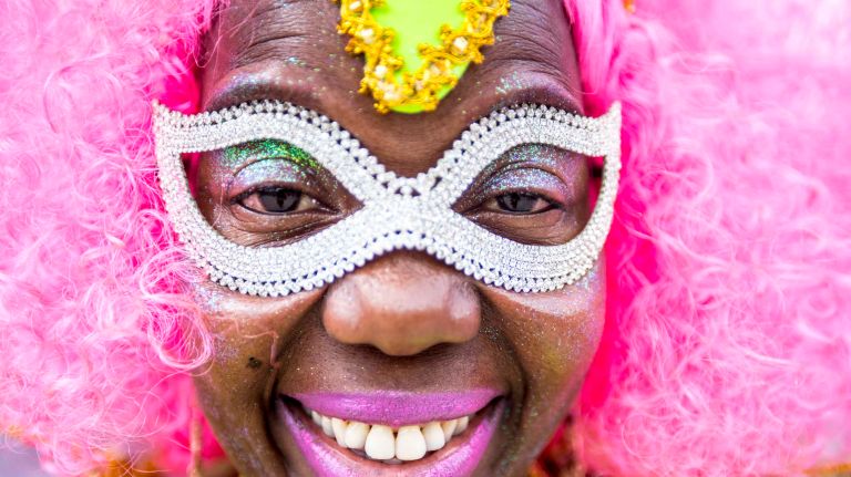 A costumed dancer gets ready to march in the West Indian Day Parade along Eastern Parkway in Brooklyn on Monday, Sept. 5, 2016.