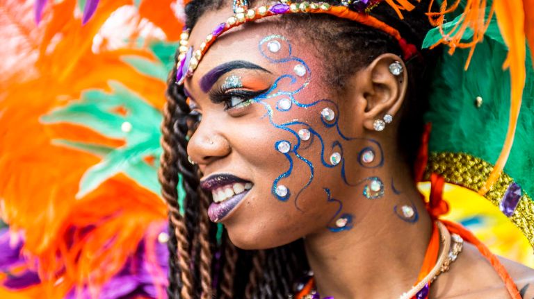 Costumed dancers get ready to march in the West Indian Day Parade along Eastern Parkway in Brooklyn on Monday, Sept. 5, 2016.