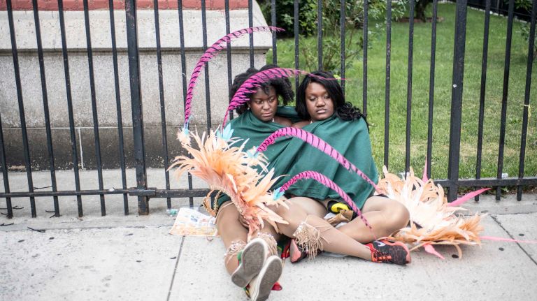 Costumed dancers get ready to march in the West Indian Day Parade along Eastern Parkway in Brooklyn on Monday, Sept. 5, 2016.