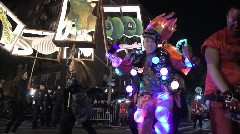 Village Halloween Parade photos highlight city's spookier side 28 Paradegoers march up Sixth Avenue in the 44th annual Village Halloween Parade in Manhattan,Tuesday, Oct. 31, 2017.