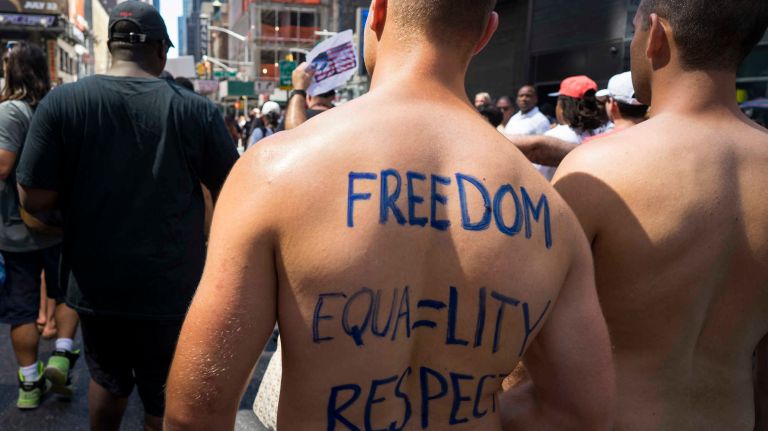 People march in the GoTopless Pride Parade on Sunday, Aug. 28, 2016, in Manhattan.