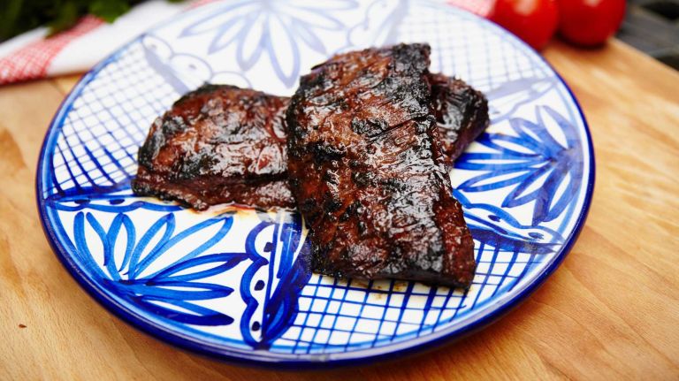 This thin, fibrous steak has a strong beefy flavor that can stand up to marinades. At Prime Time Butcher, Kreitzman sells them marinated in his own barbecue sauce. (He also likes this Asian marinade: Combine 1 cup hoisin sauce, ¼ cup prepared barbecue sauce, 1 tablespoon minced garlic and 1 tablespoon minced fresh ginger.) Skirt steaks are so thin, they are easy to overcook. Cook them with the grill cover open, and don't let them rest long before eating.