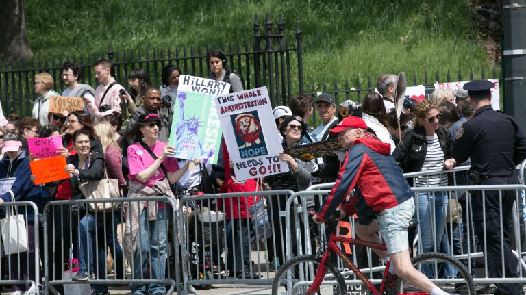 Demonstrators protest in De Witt Clinton Park before the president's visit to the Intrepid Air and Space Museum, on May 4, 2017.
