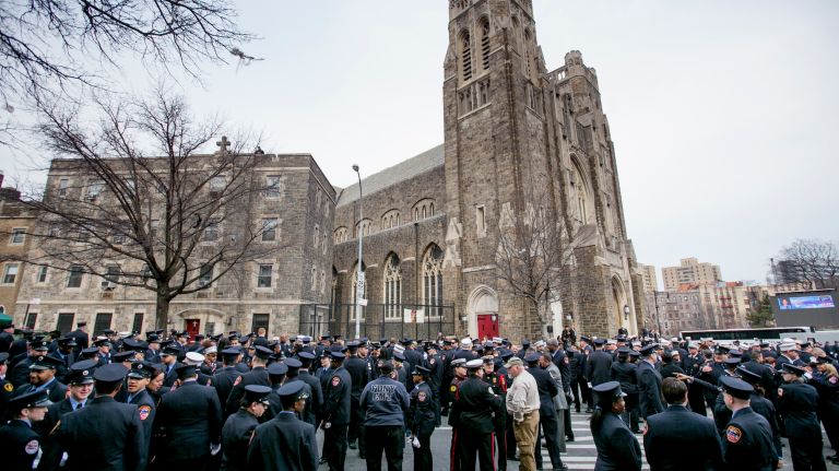 Hundreds assemble for the funeral Saturday, March 25, 2017, for slain FDNY EMT Yadira Arroyo at St. Nicholas of Tolentine Roman Catholic Church on University Avenue in the Bronx. 