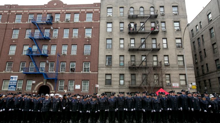 Hundreds gather Saturday, March 25, 2017, for the funeral of slain FDNY EMT Yadira Arroyo at St. Nicholas of Tolentine Roman Catholic Church on University Street in the Bronx.