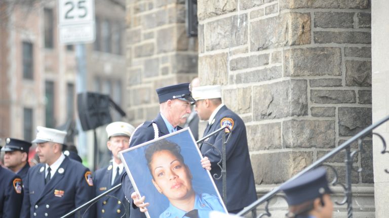 A photo of FDNY EMT Yadira Arroyo is taken inside St. Nicholas of Tolentine Roman Catholic Church on University Avenue in the Bronx before of her funeral Mass Saturday, March 25, 2017.